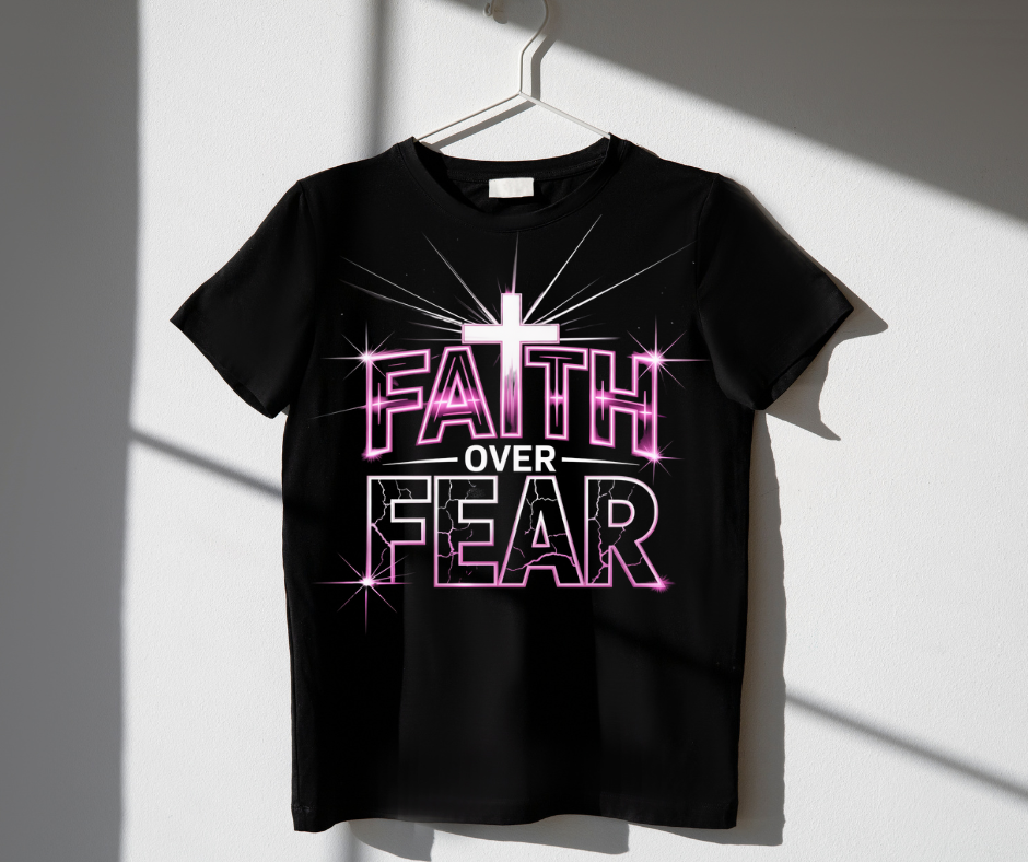 Black t-shirt with 'Faith Over Fear' text and cross on a hanger against a white background