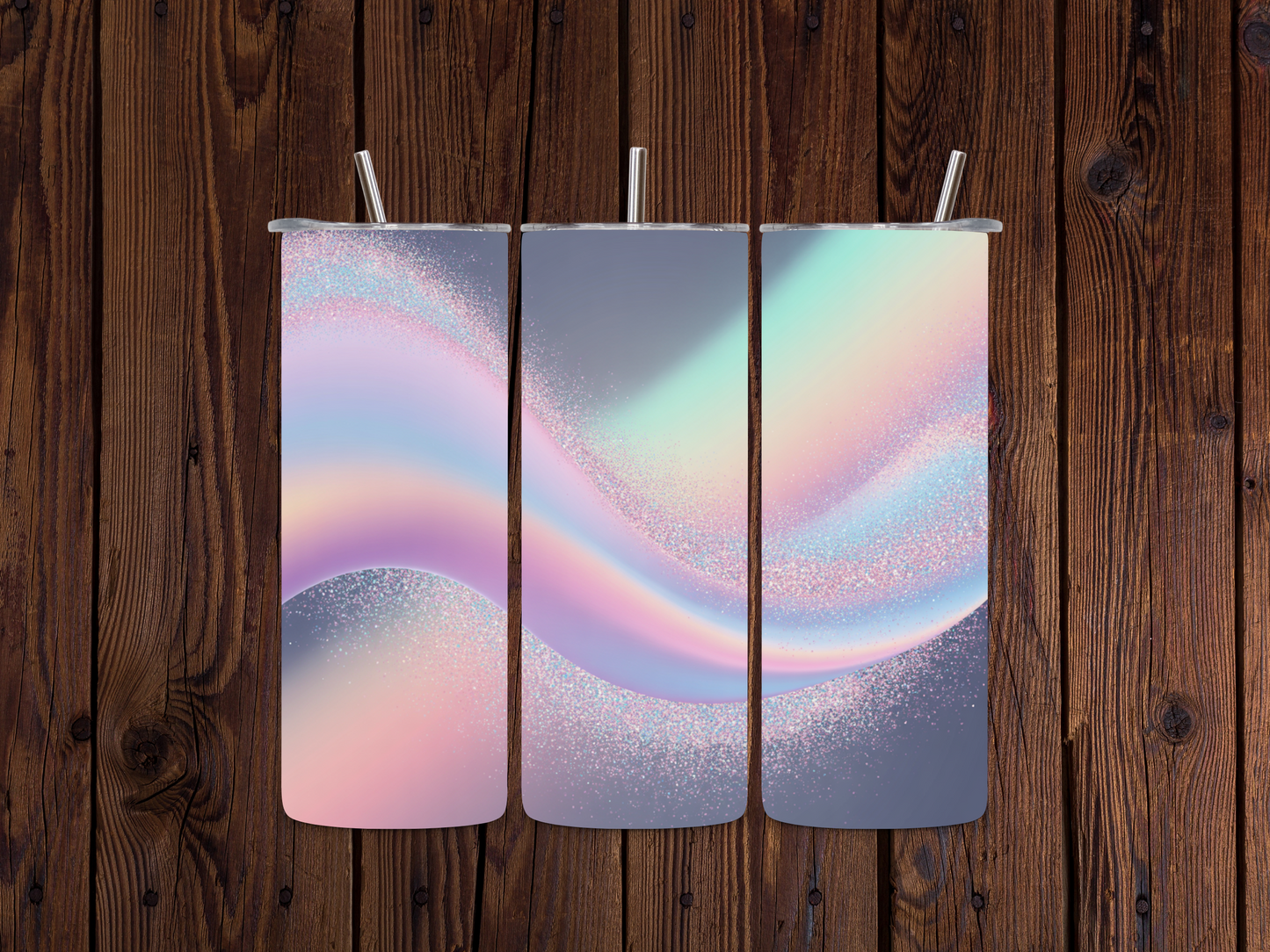 Three colorful Holographic Chunky Glitter Wrap tumblers with a wavy design on a wooden surface