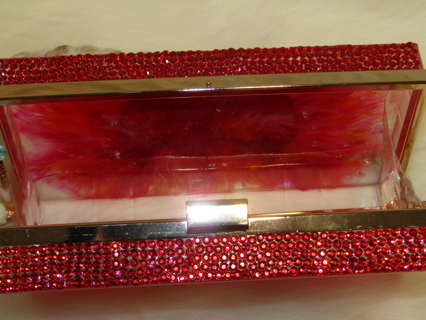 Glamorous Ruby Resin Clutch with Sparkling Rhinestones